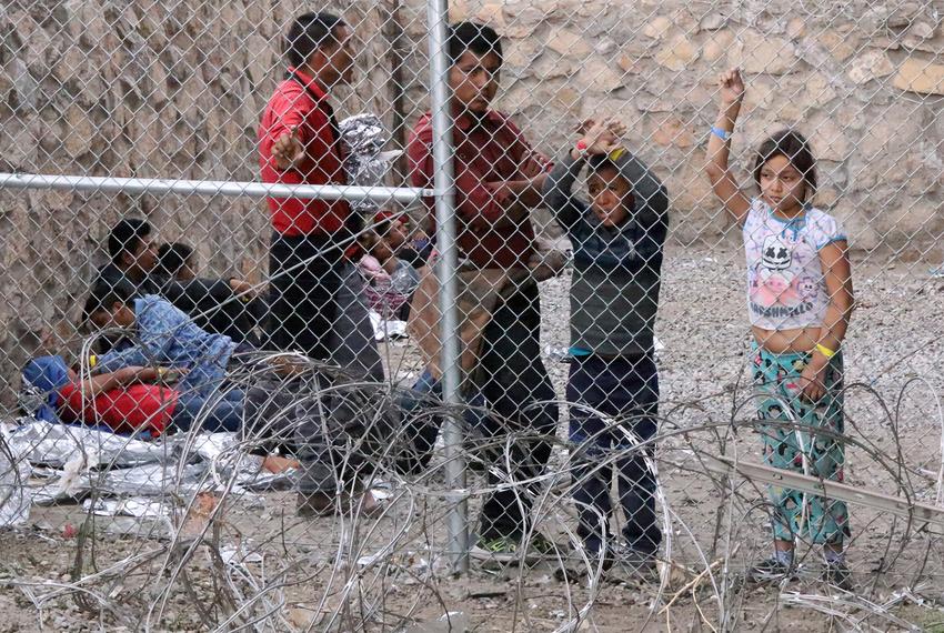 A group of migrants wait inside a holding area under the Paso Del Norte International Bridge to be taken to area processing facilities in El Paso on March 27, 2019. Carlos Antunez, a U.S. Border Patrol spokesman for the El Paso Sector, said they were among the latest group of about 3,000 migrants who presented themselves to border agents along the border fence in the El Paso area. The migrants mostly come from Guatemala, Honduras and El Salvador, he said, adding that local Border Patrol resources are being diverted to dealing the with increase in migrant arrivals in order to provide shelter, food, water and transporting the sick to local health facilities. This has led to the closure of checkpoints along I-10, U.S. 54 and U.S. 62-180 in New Mexico. U.S. Coast Guard emergency medical technicians are also on hand to assist, Antunez said.