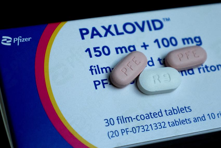 Paxlovid, Pfizer's anti-viral medication to treat the coronavirus disease (COVID-19), is displayed in this picture illustration taken Oct. 7, 2022. A morning and an evening dose consists of one white 100-milligram tablet of Ritonavir and two pink 150-milligram tablets of PF-07321332.