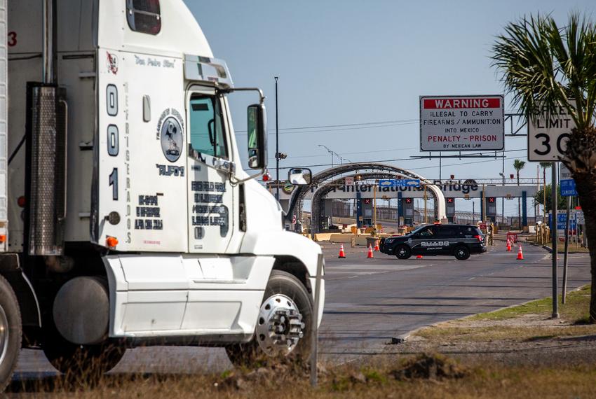 A truck drives by the Pharr–Reynosa International Bridge in Pharr on April 11, 2022.