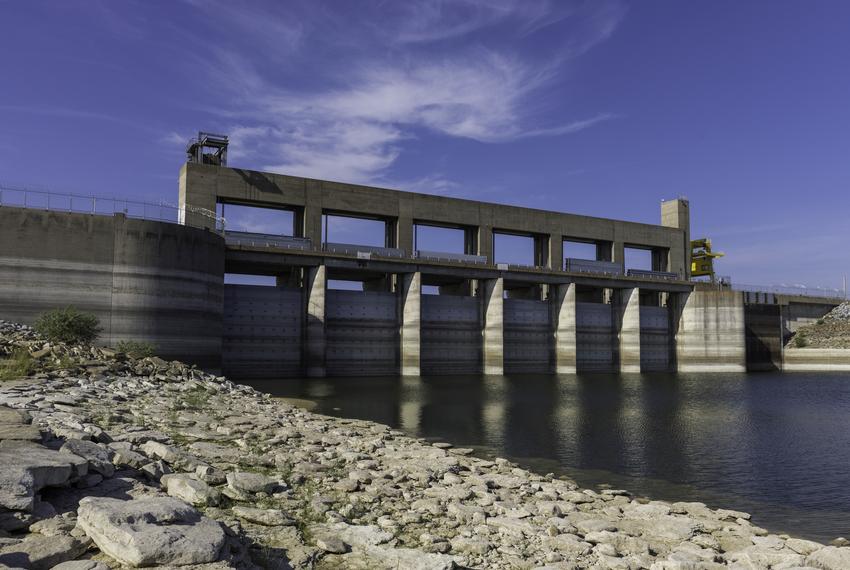 Water marks are seen on the dam gates and concrete at the Falcon Dam in Starr County on Aug. 18, 2022. This area of the reservoir is normally under water, but because of an extended drought, water levels have been below 20% full since earlier this year. The Falcon Dam was dedicated by U.S. President Dwight D. Eisenhower and Mexican President Adolfo Ruiz Cortines in 1953.