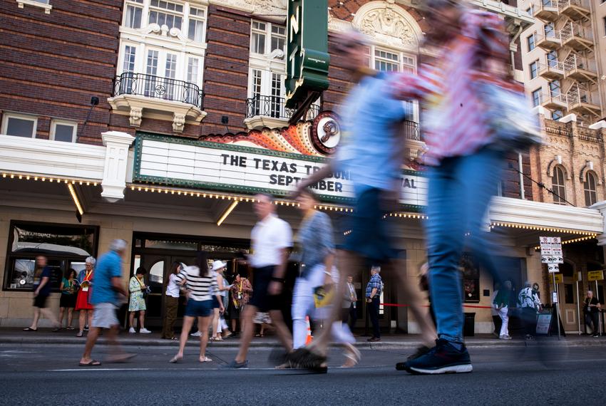 People walk outside of The Paramount Theatre during Open Congress at The Texas Tribune Festival on Sept 23, 2023.