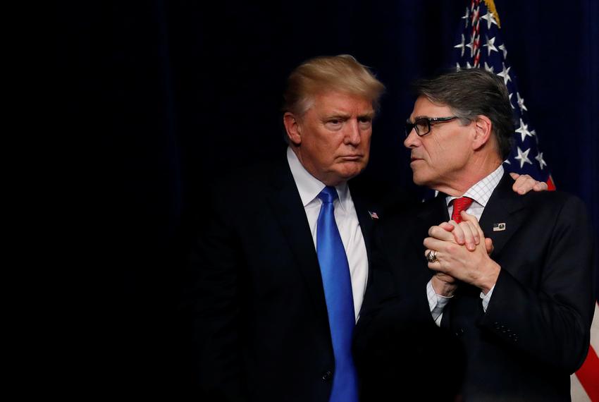 President Donald Trump talks with Energy Secretary Rick Perry after delivering remarks during an "Unleashing American Energy" event at the Department of Energy in Washington, D.C.  on June 29, 2017.