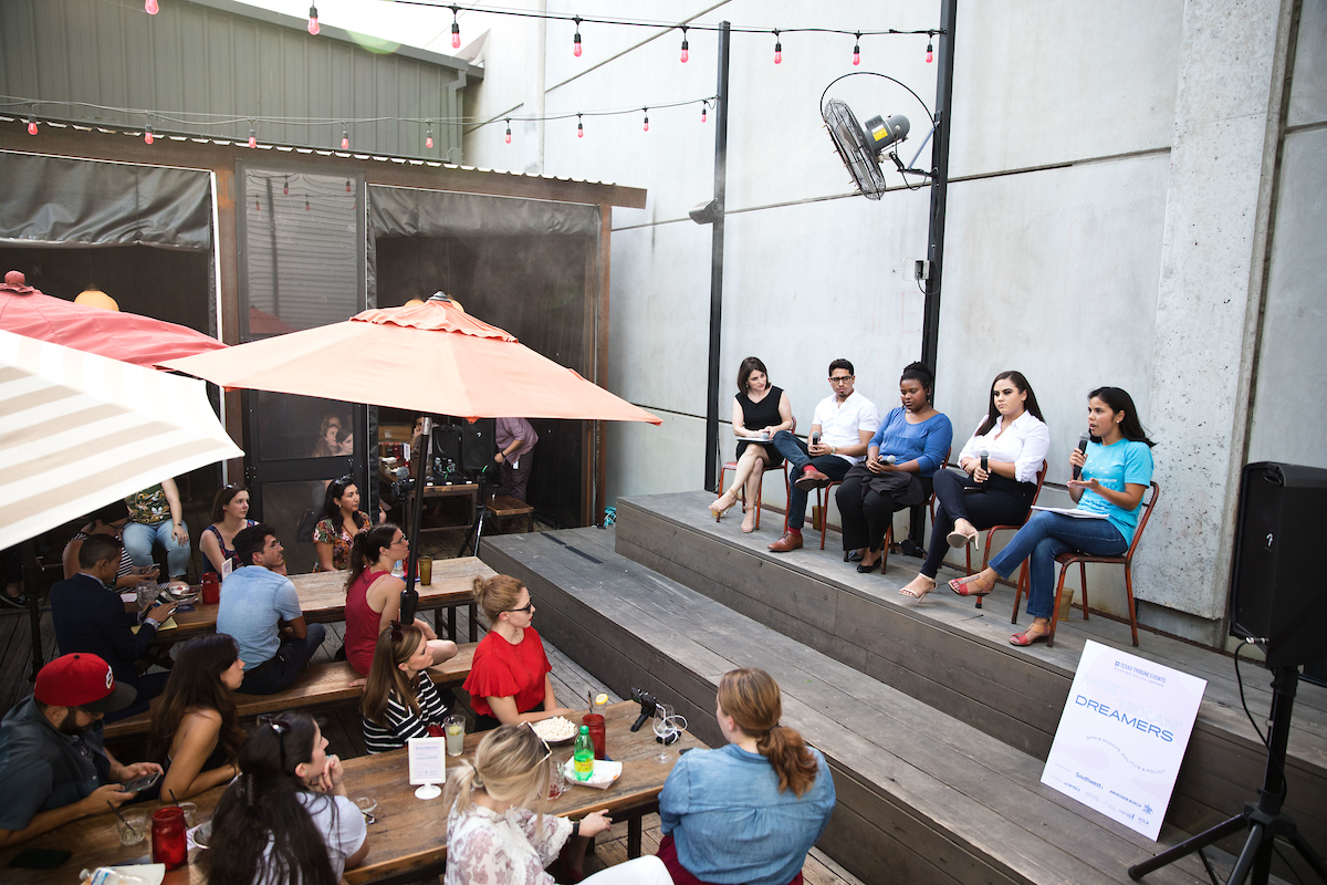 Panelists for the Summer Salons: Meet Texas Dreamers event speak to the crowd at Irene’s in Austin, Texas.