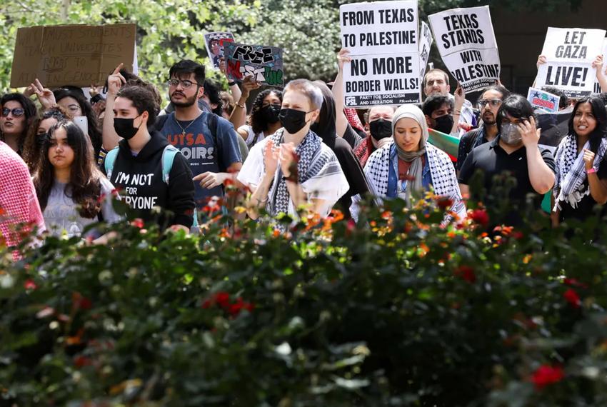 Pro-Palestinian protesters calling for a ceasefire in Gaza march through the outdoor corridors of UTSA on Wednesday, April 24, 2024.