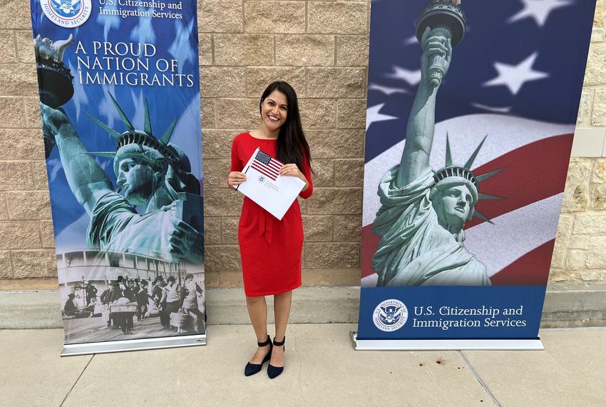 Natalia Contreras poses for a photo holding her naturalization papers after her citizenship ceremony on May 19, 2023, at the US Citizenship and Naturalization Services field office in San Antonio, Texas.