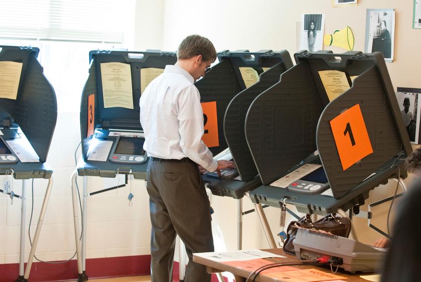 A man casts his ballot in a 2014 election.